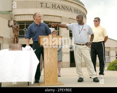 Former T.L. Hanna High School football coach, Harold Jones, right