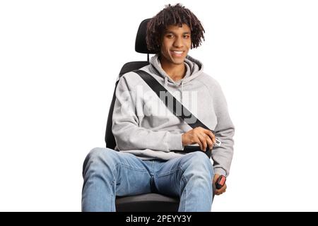 Portrait of an african american young man in a car seat fastening a seatbelt isolated on white background Stock Photo