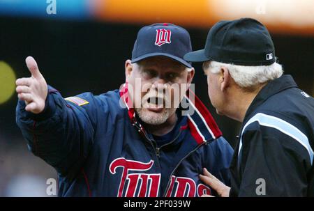 First base umpire Joe Brinkman makes the call on a runner thrown