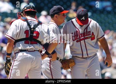 From left, Atlanta Braves catcher Tyler Flowers, left, shortstop Dansby  Swanson and relief pitcher Sean Newcomb gather on the mound after Newcomb  hit New York Mets' Robinson Cano with a pitch during