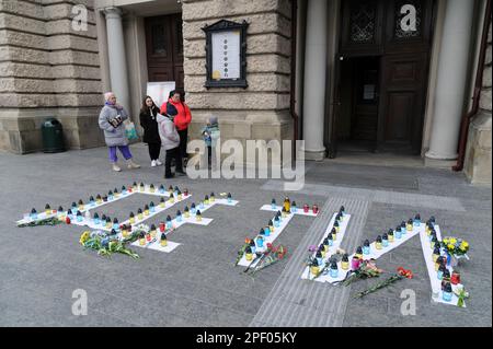 Lviv, Ukraine 16 march 2023. Candles are displayed on letters reading the word 'Children' in Russian language during a commemorative event to mark the first anniversary of the bombing of the Mariupol Drama Theatre, held in the western Ukrainian city. Stock Photo