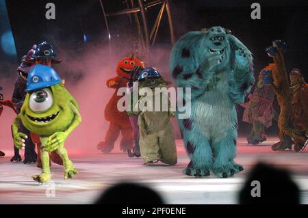 Ice skaters dress as characters from the motion picture, Monsters, Inc. are  seen performing during the opening scene of Disney on Ice presents  Disney/Pixar's Monsters, Inc., Wednesday, April 21, 2004, at ALLTEL