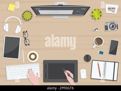 Wood textured table from top view with hands of woman drawing on digital graphic tablet with monitor, camera, tablet, headphones and gadgets, design f Stock Vector