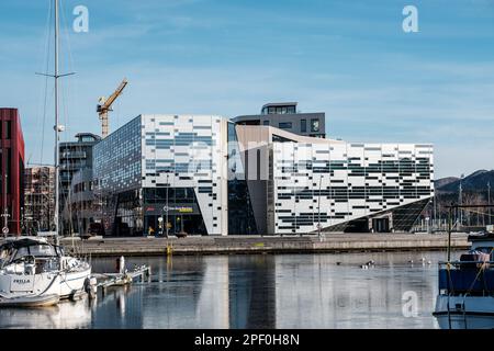 Sandnes Norway, March 10 2023, Multi-Use Commercial Building Banks And Restaurants Modern Architecture Design Along Quay Waterfront With Frozen Water Stock Photo