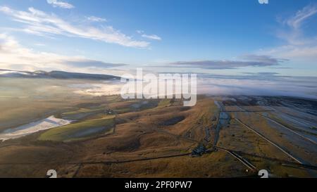 Cloud inversion over Cumbrian countryside, with Howgill Fells in the background. Ravenstonedale, Cumbria. Stock Photo