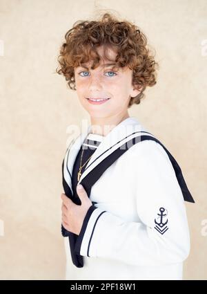 interno nostalgia saldar catholic christian teenage boy making `primera comunión with curly ginger  hair in white suit with blue collar and cross on neck with copy space Stock  Photo - Alamy