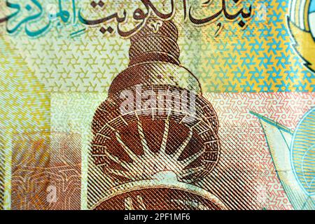 The Liberation Tower closeup from obverse side of Kuwaiti quarter dinar brown paper banknote cash money bill currency that also features a dhow ship Stock Photo