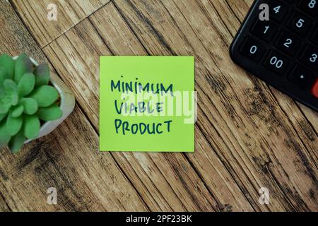 Concept of Minimum Viable Product write on sticky notes isolated on Wooden Table. Stock Photo