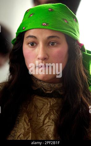 A Romanian Gypsy girl looks on in Costesti, Romania, 250 west of