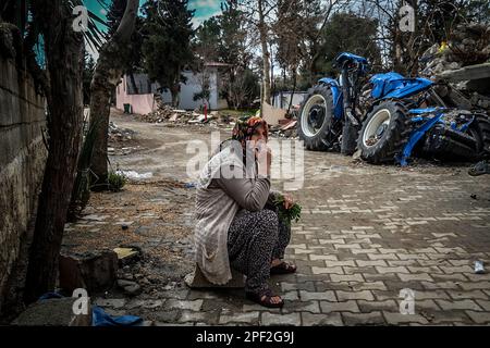 An Earthquake Survivor Seen Sitting Sadly. One Of The Most Damaged ...