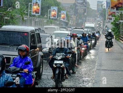 Malang, East Java, Indonesia. 16th Mar, 2023. People stuck in traffic jams during rush hour in Malang. The Indonesian National Police (Polri) noted that the number of motorized vehicles in Indonesia reached 152.51 million units as of December 31 2022. Of these, 126.99 million units or 83.27% of them in the form of a motorcycle. A total of 19.31 million motorized vehicles in Indonesia are passenger cars. (Credit Image: © Moch Farabi Wardana/Pacific Press via ZUMA Press Wire) EDITORIAL USAGE ONLY! Not for Commercial USAGE! Stock Photo