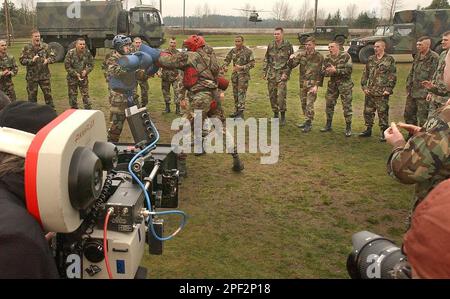 https://l450v.alamy.com/450v/2pf2p18/a-blackhawk-helicopter-rises-in-the-background-on-cue-as-sgt-derik-brame-left-and-spc-emmett-middaugh-right-use-pugil-sticks-wednesday-jan-21-2004-at-ft-lewis-wash-during-the-filming-of-a-segment-of-fight-back-for-the-army-of-one-television-commercial-more-than-100-soldiers-from-1st-battalion-24th-infantry-division-will-participate-in-the-filming-of-three-separate-army-recruiting-commercials-this-week-at-fort-lewisap-photothe-news-tribune-russ-carmack-2pf2p18.jpg