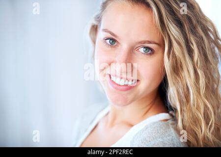 Wholesome and beautiful. A striking young blonde feeling free and relaxed - Copyspace. Stock Photo