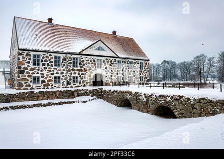 View of a snow covered Hovdala Castle in Hassleholm region. Hovdala Castle is a castle in Hassleholm Municipality, Scania, in southern Sweden. Stock Photo