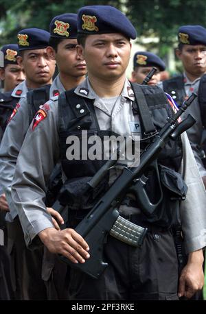 Police officers line up to show their respect as the cortege carrying ...