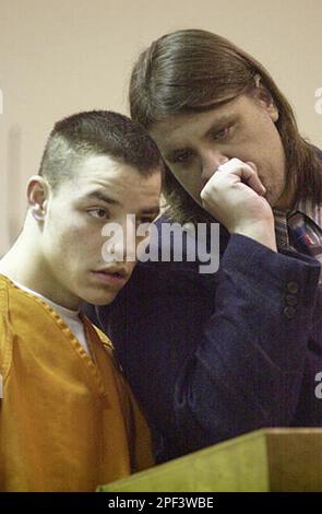 In a November 2002 photo Chadrick Fulks is led from a preliminary