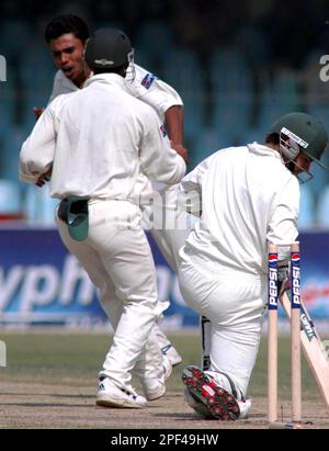 Pakistan Leg Spinner Danish Kaneria Celebrates Taking The Wicket Of ...