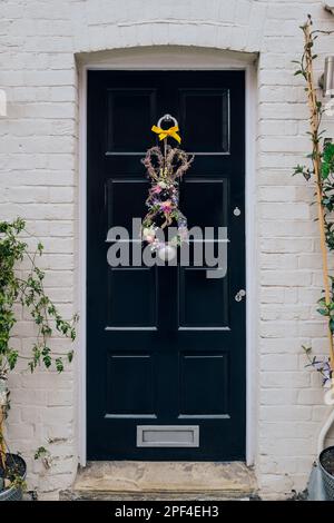 Easter wreath bunny decorations on a black front door of a house in London, UK. Stock Photo