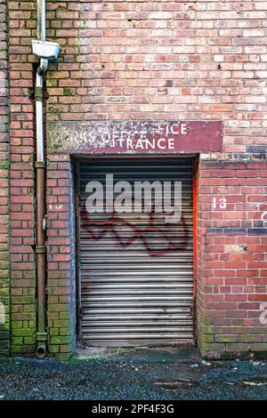 Metal roller door to Liverpool Docklands warehouse Stock Photo