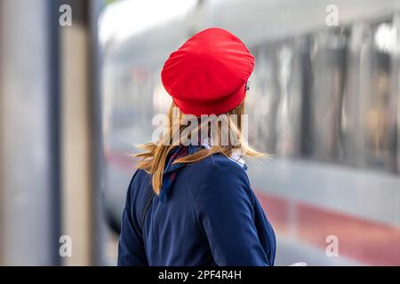 Train supervisor, Deutsche Bahn employee with red cap, Stuttgart main station, Baden-Wuerttemberg, Germany Stock Photo
