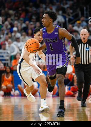 Furman Paladins Guard JP Pegues (1) Tries To Drive Past Tulane Green ...