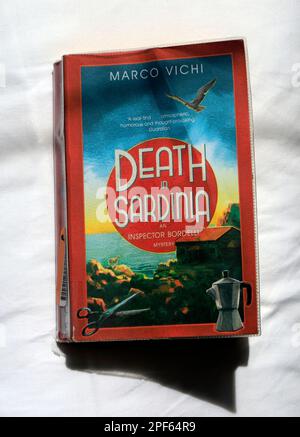 Death in Sardinia paperback book cover. Worn. Marco Vichi Stock Photo
