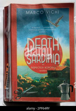 Death in Sardinia paperback book cover. Worn. Marco Vichi Stock Photo