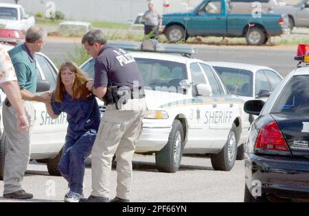 Meridian Police Officer Ricky Roberts consoles Brandie Tiller after she ...