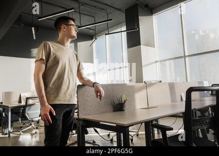 Modern Office: Portrait of Stylish Developer, Data Analysis and Creative Designer. Digital Entrepreneur Works on e-Commerce Startup Stock Photo