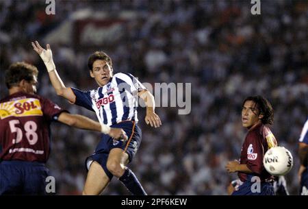 Monterrey's soccer player Guillermo Franco, front, from Argentina head the  ball as Toluca' Carlos Esquivel challenges during the first leg of the  Mexican league championship soccer final at the Nemecio Diez stadium