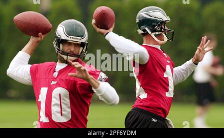 Philadelphia Eagles quarterback Koy Detmer, left, runs a passing drill with  fellow quarterback, A.J. Feeley, right, during the team's mini-camp  Wednesday, May, 28, 2003, in Philadelphia. (AP Photo/Brad C Bower Stock  Photo 