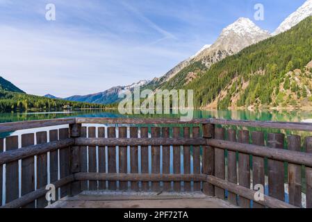 Morning light and still water with reflections at Lake Anterselva, also known as AntholzerSee or Lake Antholz, in South Tyrol, Italy. Stock Photo