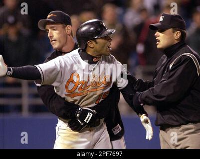 Baltimore Orioles second baseman Jerry Hairston watches as New York Yankees  David Justice beats his throw to first Tuesday night, June 5, 2001 at Yankee  Stadium In New York. The Orioles beat