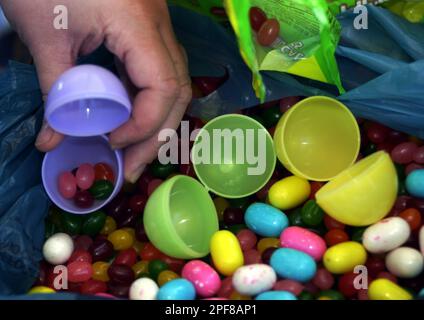 Michelle Dombroski fills plastic egg shells with candy and gum