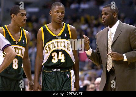 https://l450v.alamy.com/450v/2pf8w2t/seattle-supersonics-coach-nate-mcmillan-right-talks-to-newly-acquired-players-ray-allen-center-and-kevin-ollie-during-the-fourth-quarter-of-the-supersonics-106-101-loss-to-the-los-angeles-lakers-in-los-angeles-sunday-feb-23-2003-the-supersonics-traded-gary-payton-and-desmond-mason-to-the-milwaukee-bucks-for-allen-ollie-and-ronald-murray-on-feb-20-2003-and-in-a-separate-trade-sent-kenney-anderson-to-the-new-orleans-hornets-for-elden-campbell-ap-photolucy-nicholson-2pf8w2t.jpg