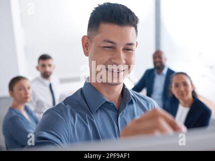 Smiling mixed race business manager training and teaching team of colleagues in office. Hispanic businessman using a whiteboard to write and explain Stock Photo