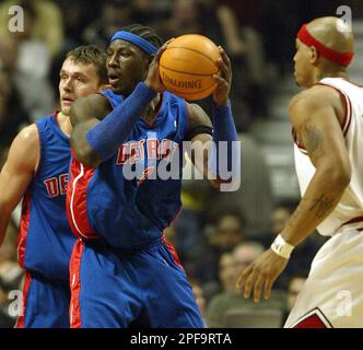 Chicago Bulls forward Marcus Fizer, left, fights off Milwaukee Bucks center  Daniel Santiago for a fourth-quarter slam dunk Friday, March 26, 2004, at  the United Center in Chicago. The Bucs went on