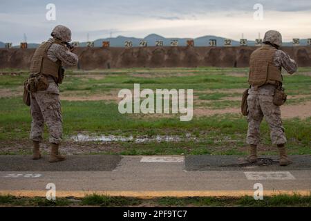 U.S. Marine Corps recruits with Alpha Company, 1st Recruit Training Battalion, participate in the table two course of fire on Marine Corps Base Camp Pendleton, Calif. March 14, 2023. All recruits participated in the table two rifle qualification course during the 3rd phase of recruit training. (U.S. Marine Corps photo by Cpl. Grace J. Kindred) Stock Photo