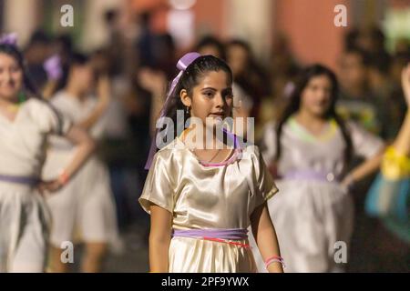 Matamoros, Tamaulipas, Mexico - Dicember 9, 2022: The Desfile de Navidad, Dancers wearing traditional clothing performing at the parade Stock Photo