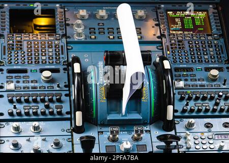 Flight control panel and flight management system in civil airplane cockpit. Stock Photo