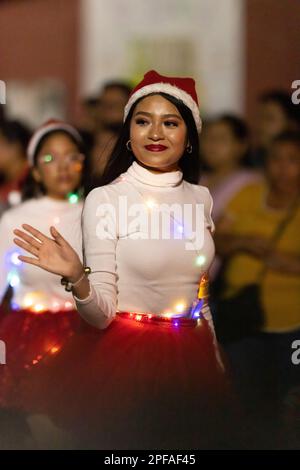 Matamoros, Tamaulipas, Mexico - Dicember 9, 2022: The Desfile de Navidad, Dancers wearing traditional clothing performing at the parade Stock Photo