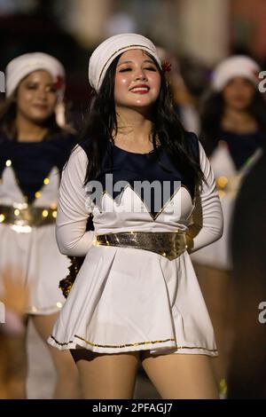 Matamoros, Tamaulipas, Mexico - Dicember 9, 2022: The Desfile de Navidad, Cheerleaders wearing traditional clothing performing at the parade Stock Photo