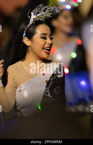 Matamoros, Tamaulipas, Mexico - Dicember 9, 2022: The Desfile de Navidad, Cheerleaders wearing traditional clothing performing at the parade Stock Photo