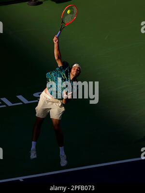 March 16, 2023 Taylor Fritz returns a shot against Jannik Sinner of