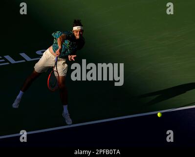 March 16, 2023 Taylor Fritz returns a shot against Jannik Sinner of