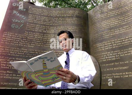 Massachusetts Republican gubernatorial candidate W. Mitt Romney reads the Dr. Seuss book, Oh the Places You'll Go!, to a group of children at the Dr. Seuss National Memorial Sculpture Garden in Springfield, Mass., on Wednesday, July 31, 2002. (AP Photo, Union-News, Mark Murray)