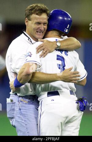 Toronto Blue Jays third baseman Kelly Gruber, right, congratulates relief  pitcher Tom Henke after Henke saved Game 4 of the World Series against the  Atlanta Braves at SkyDome in Toronto, Oct. 22