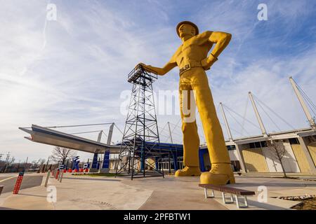 Oklahoma, MAR 1 2023 - Sunny exterior view of the Golden Driller Statue in Tulsa Expo Center Stock Photo