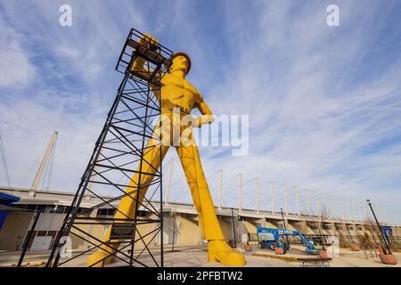 Oklahoma, MAR 1 2023 - Sunny exterior view of the Golden Driller Statue in Tulsa Expo Center Stock Photo