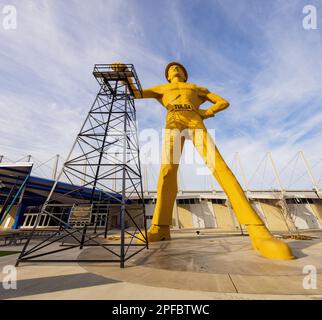 Oklahoma, MAR 1 2023 - Sunny exterior view of the Golden Driller Statue in Tulsa Expo Center Stock Photo